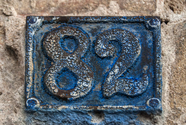 istock Old retro cast iron plate number 82 1289063616