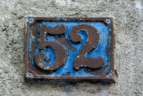 istock Old retro cast iron plate number 52 1289063618
