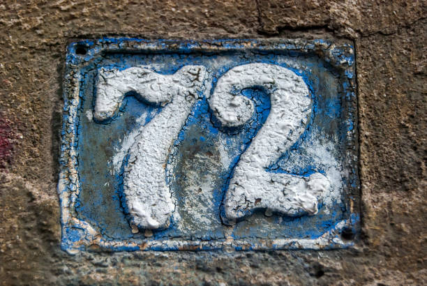 istock Old retro cast iron plate number 72 1289063619