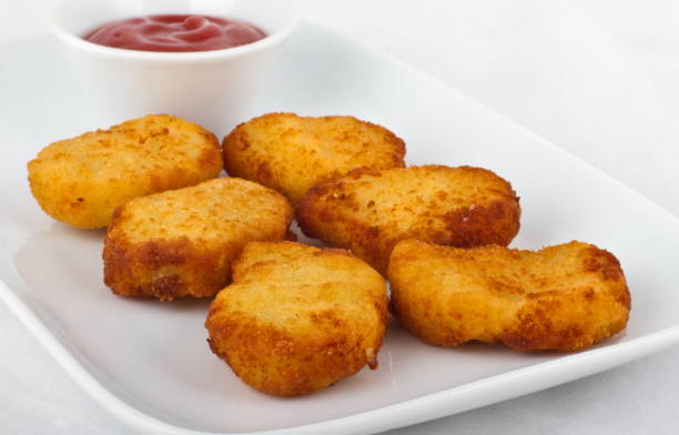istock Six slices of chicken nuggets with ketchup 1289066441