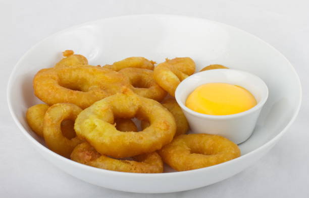 istock Tempura squid rings with cheese sauce 1289066481