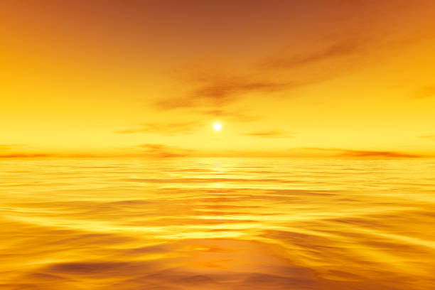 istock beautiful yellow sunset over the ocean background 1289067509