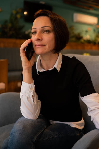 istock Woman having a phone call at the restaurant 1289067593