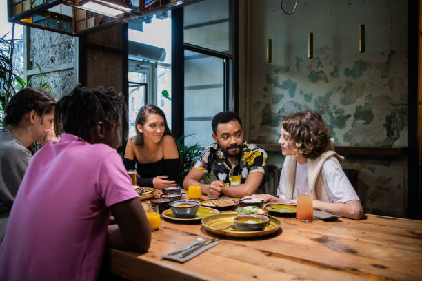 istock Highschool students having a lunch in a modern cafe 1289067741