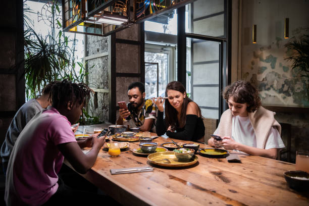 istock A multi-ethnic group of students eating in a modern cafe with fr 1289067761
