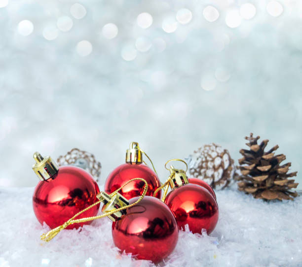 istock Christmas ornaments with pines on the back on snow 1289067859