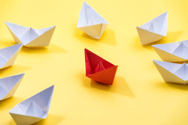 istock Leadership Concept With Paper Boats 1289069291