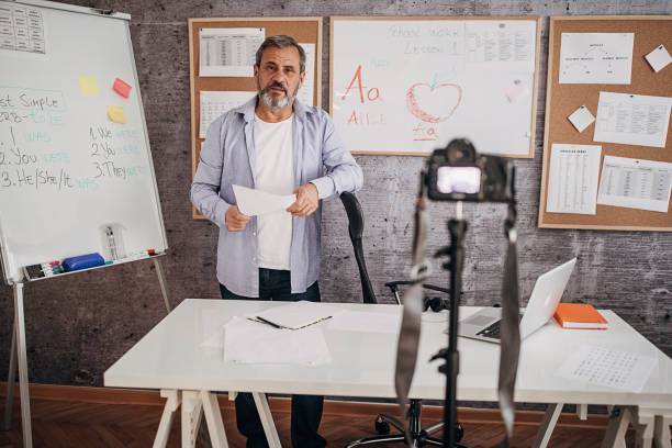 istock Male teacher lecturing students during isolation period 1289071849