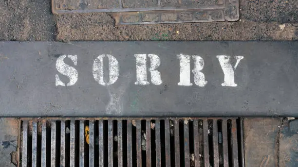 An image of the word sorry at the street
