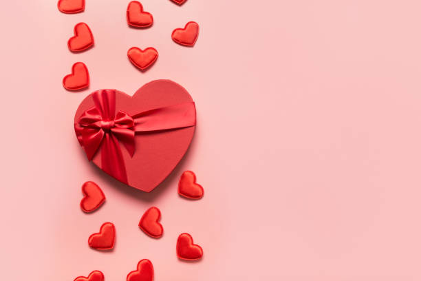 istock Valentine's Day concept with red boxes and hearts on pink. 1289073494