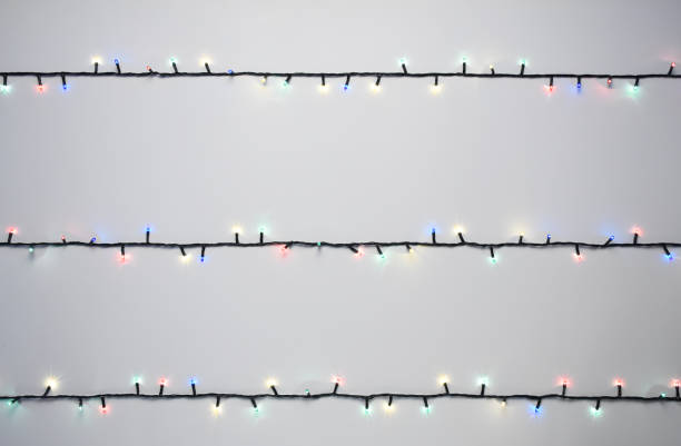 istock Christmas lights on the white background with copy space 1289074335