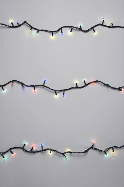 istock Christmas lights on the white background 1289074412