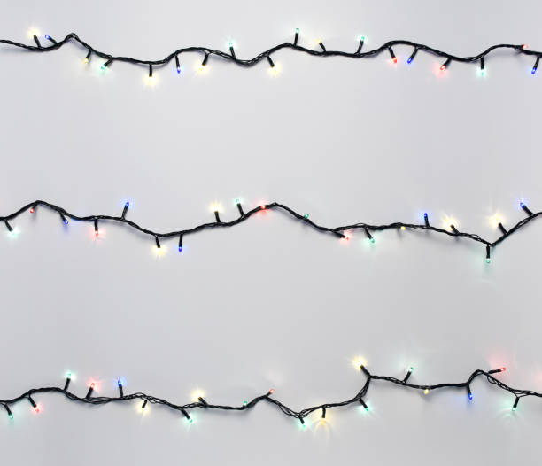 istock Christmas lights on the white background 1289074757