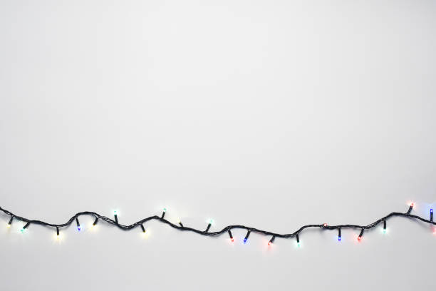 Christmas lights on the white background with copy space