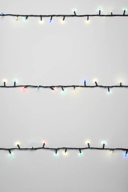istock Christmas lights on the white background 1289075215