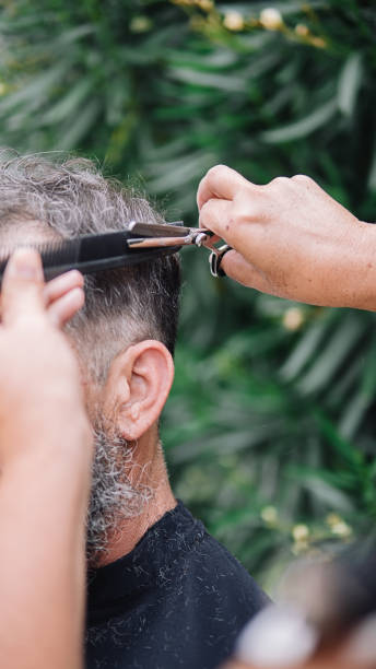 istock Closeup Man Getting Haircut 1289076212