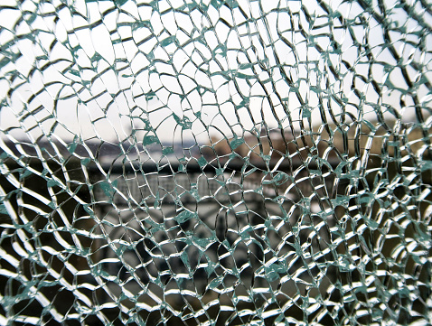 toughened glass in the cracks behind the bridge fence.