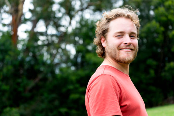 istock Portrait of modern young man, background with copy space 1289077774