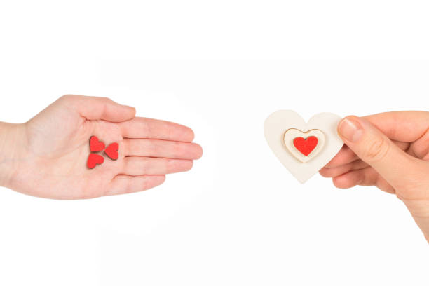 istock Red heart in woman hand isolated. 1289078421