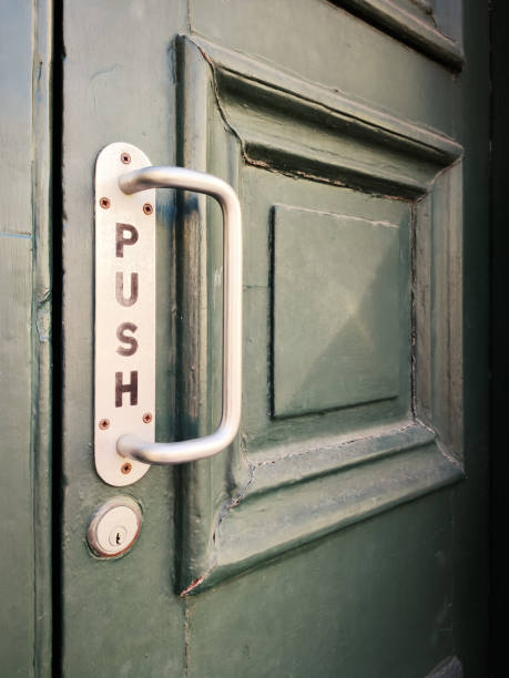 istock Old door with door handle and the inscription push 1289078846