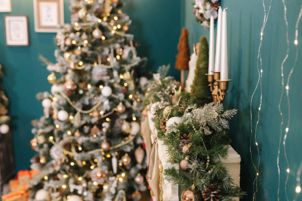 istock Beautiful holdiay decorated room with Christmas tree and with presents under it. Different elements of decor 1289079008
