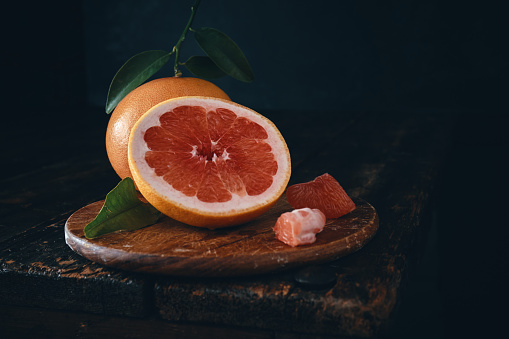 Grapefruit on Rustic Black Background