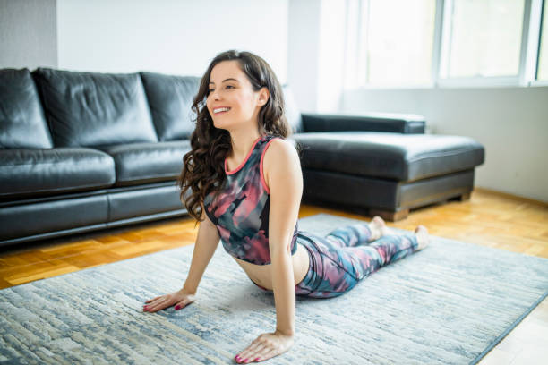 istock Fit woman exercising at home 1289080142