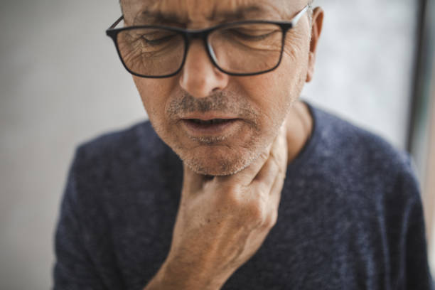istock Senior Man With Throat Pain 1289080875