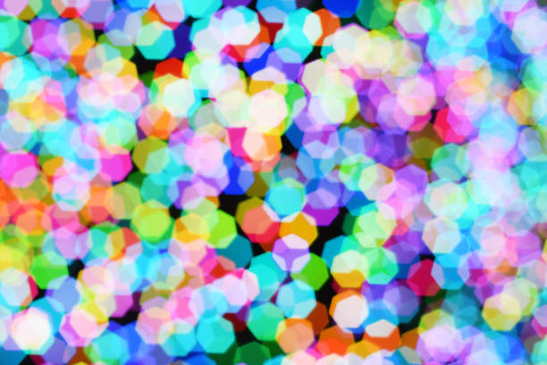 istock Christmas background, garland in blur. Glowing and festive colored light circles created in camera and bokeh lens. Christmas fairy lights are defocused giving a blurry effect. 1289081051