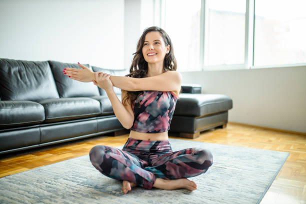 istock Woman stretching and having home workout 1289081054