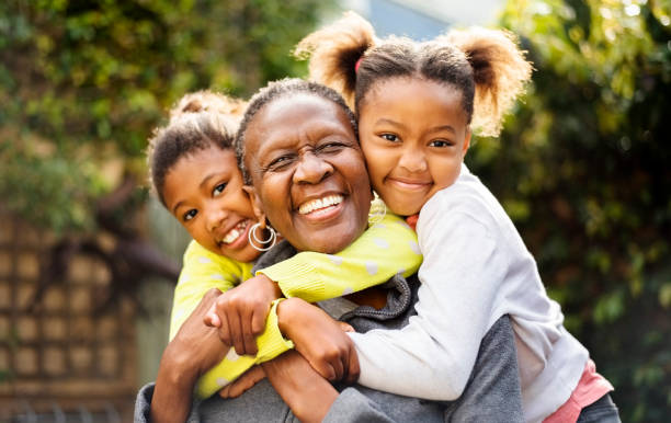 amo i miei nipoti! - grandmother senior adult smiling women foto e immagini stock