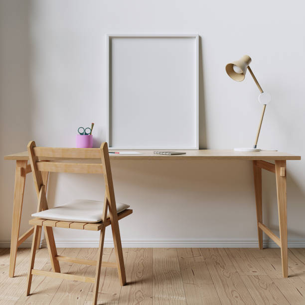istock 8x10 White Mockup Frame positioned on a wooden desk 1289085779