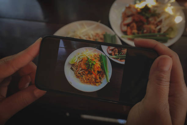 istock hands taking photo on food 1289085906