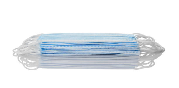 istock Stack of surgical face masks on a white background. 1289087697