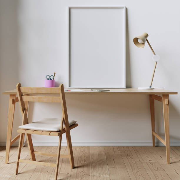 istock A2 White Mockup Frame positioned on a wooden desk 1289088742