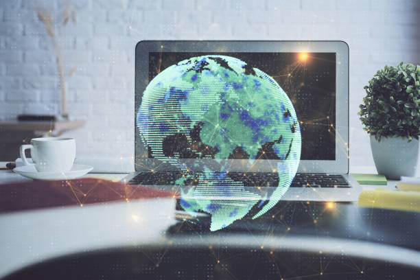 istock Computer on desktop with social network hologram. Multi exposure. Concept of international people connections. 1289088884