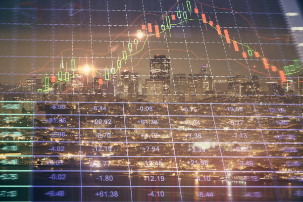 istock Financial graph on night city scape with tall buildings background double exposure. Analysis concept. 1289089044
