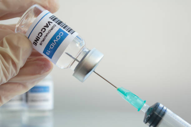 istock Doctor hand preparing Covid-19 Coronavirus vaccine 1289089249