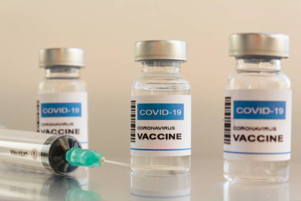 istock Syringe and Injection Vial with Covid-19 coronavirus vaccine 1289089267