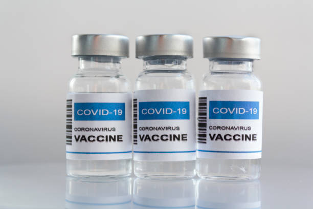 istock Laboratory Injection Vials with Covid-19 coronavirus vaccine and syringe 1289089306