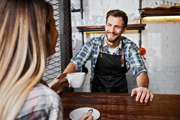istock Customer at a coffee shop buying coffee 1289089843
