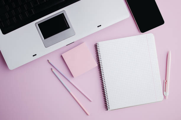 istock Woman workplace. Home office on pink background 1289091751