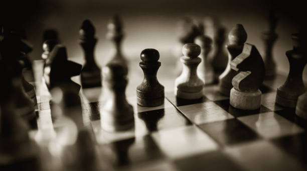 istock Wooden chess pieces on the chessboard. Intellectual game -chess. 1289092486