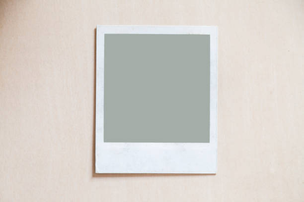 istock Photograph placed on a wooden table with applicable background 1289092688