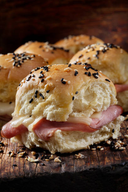 istock Baked Ham And Swiss Sliders on White Dinner Buns 1289094070