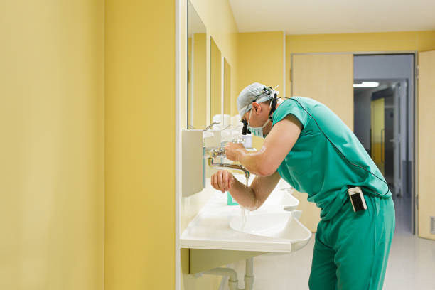 istock Surgeon washing his hands before operating. Healthcare concept 1289095670