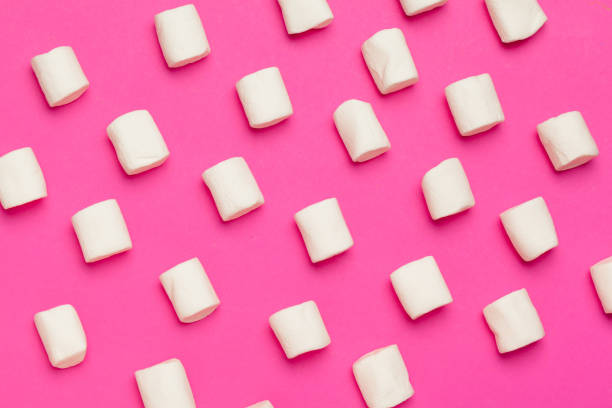 istock Marshmallows on color background. top view. creative photo. 1289096430