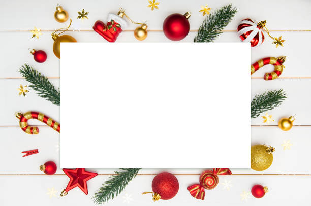istock Flat lay composition with Christmas decoration and blank card on white wooden table. 1289096594
