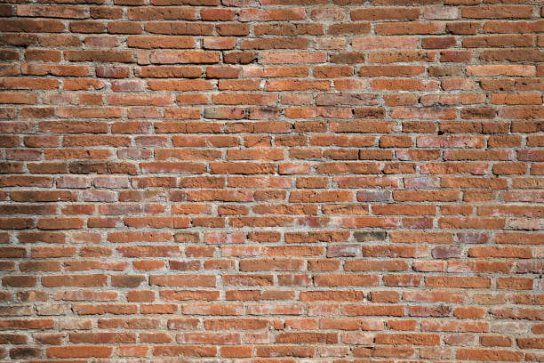 istock Red bricks wall with hard light and shadow in sunny day 1289098811