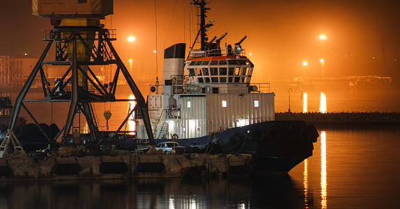 night view of the tugboat in the cargo port of Odessa